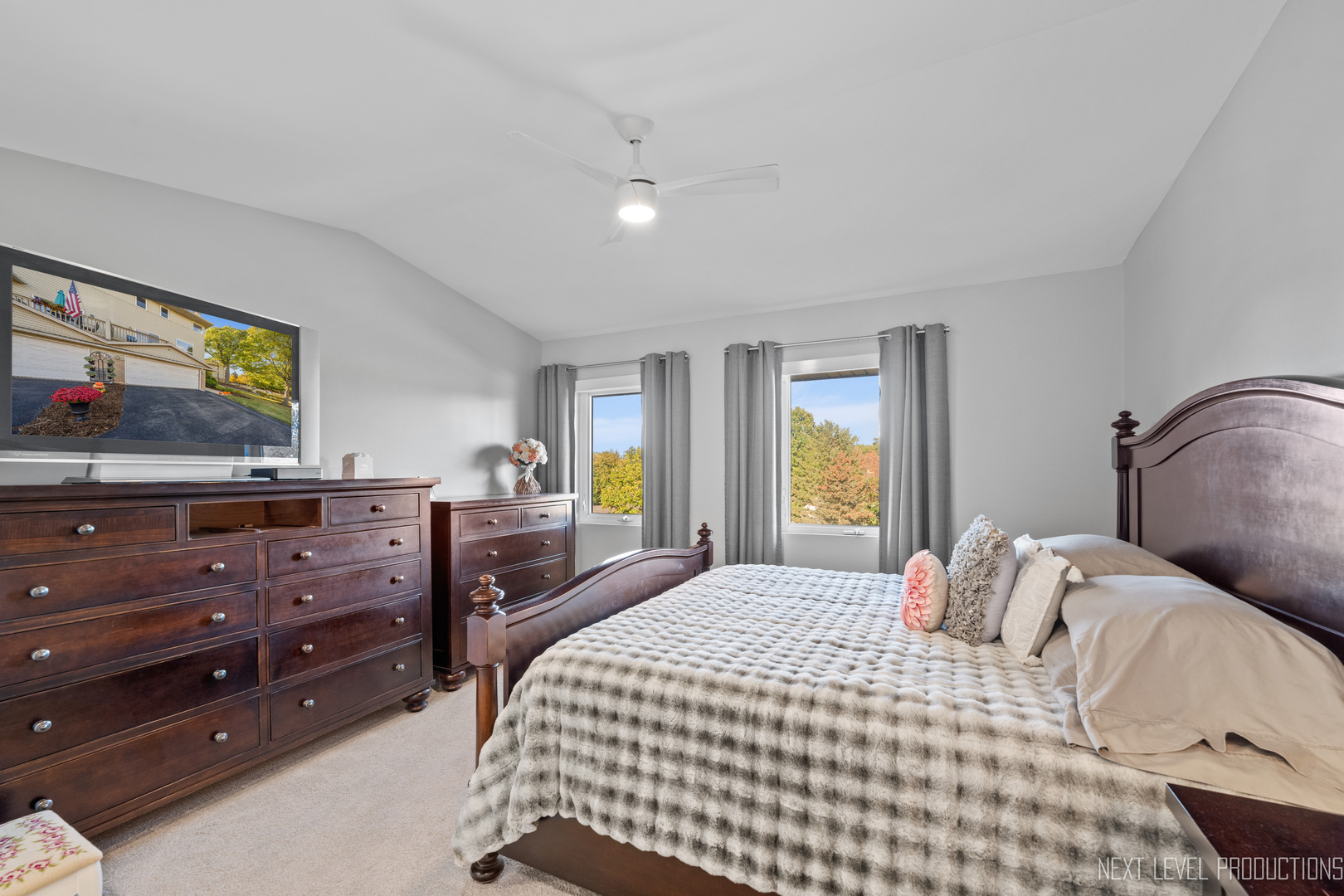 479 River Bend Road, Unit 111 Naperville, IL 60540 - Photo 15 of 25 a bedroom with a bed and a mirror on dresser