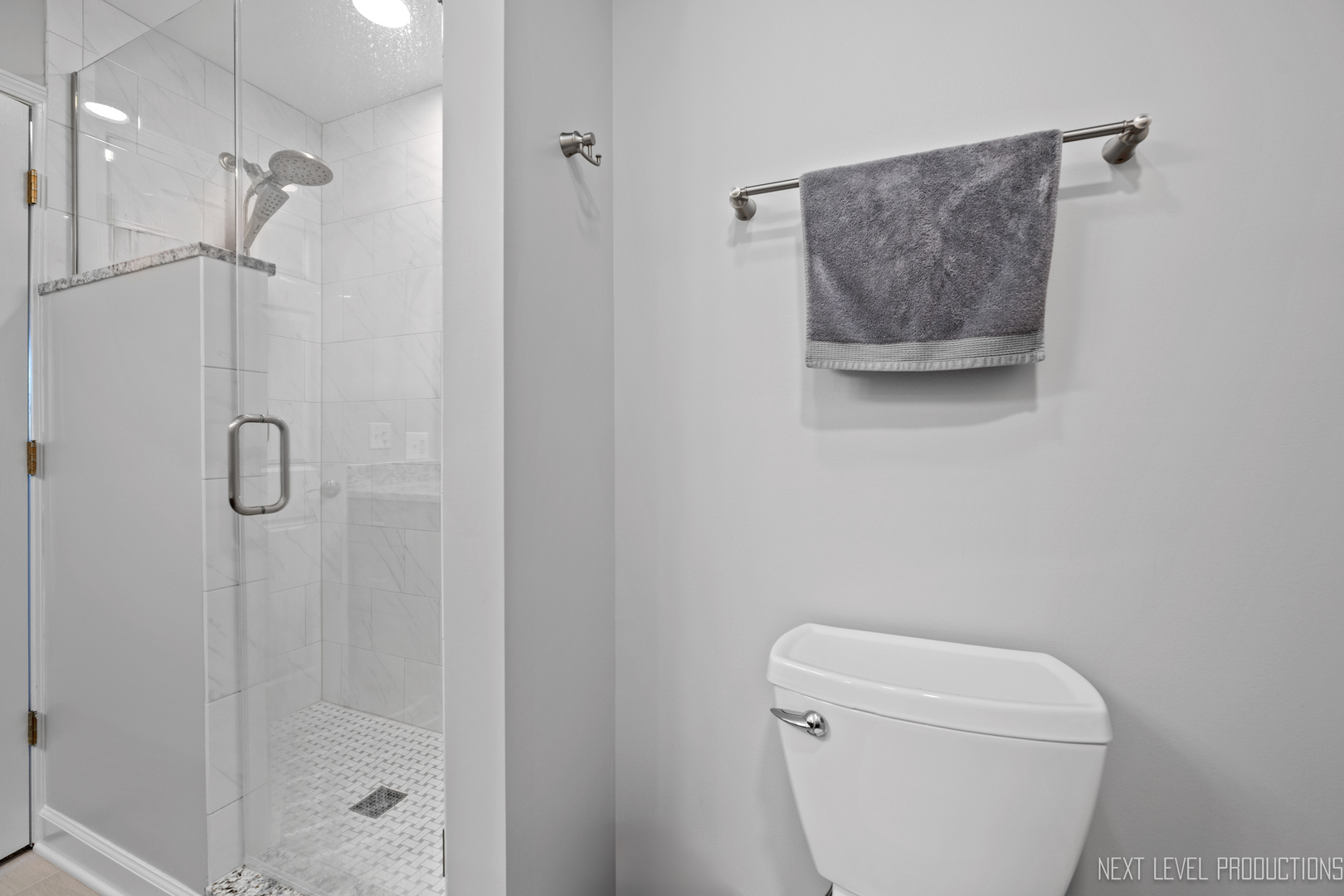 479 River Bend Road, Unit 111 Naperville, IL 60540 - Photo 17 of 25 a bathroom with a toilet and a shower