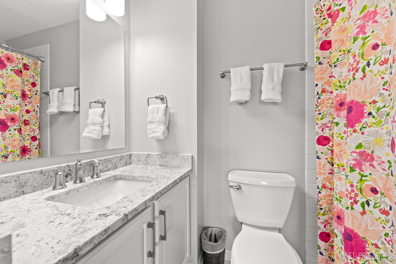 479 River Bend Road, Unit 111 Naperville, IL 60540 - Photo 20 of 25 a bathroom with a granite countertop toilet sink vanity and mirror