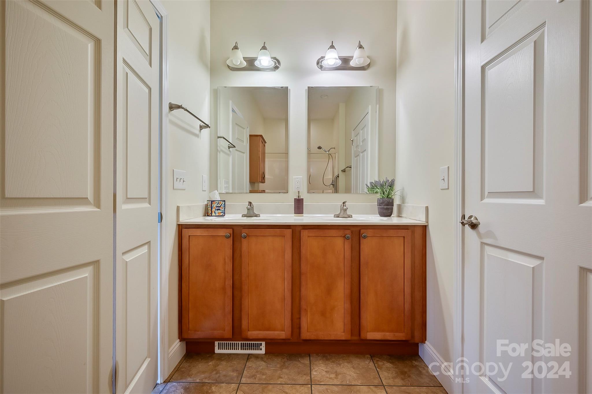 1975 Whiteside Road Mill Spring, NC 28756 - Photo 21 of 37 a bathroom with a mirror sink and vanity