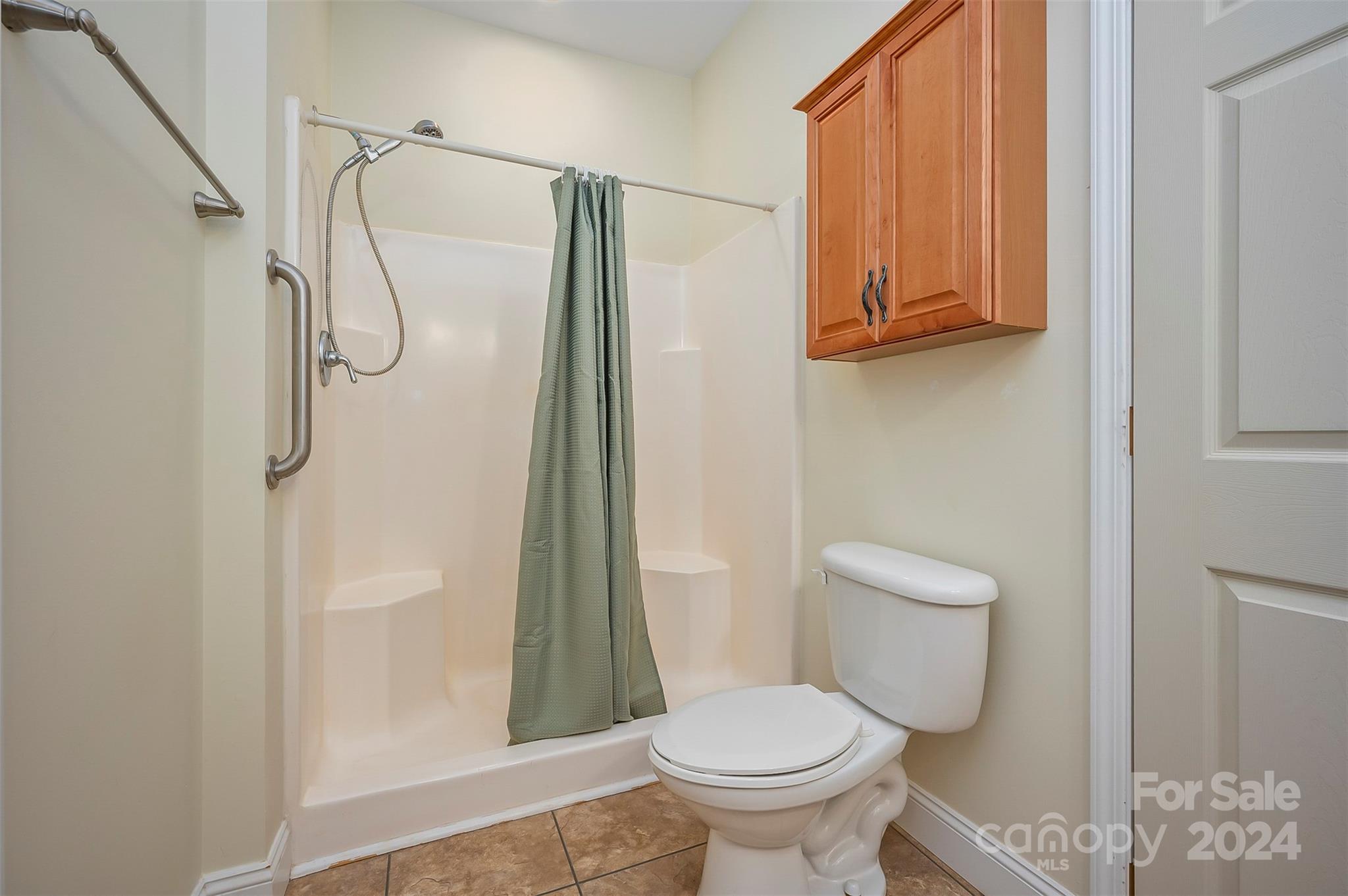1975 Whiteside Road Mill Spring, NC 28756 - Photo 22 of 37 a bathroom with a toilet and a shower
