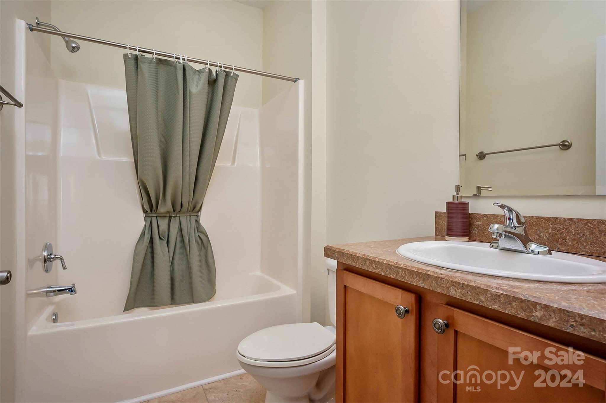 1975 Whiteside Road Mill Spring, NC 28756 - Photo 25 of 37 a bathroom with a granite countertop sink toilet and a mirror