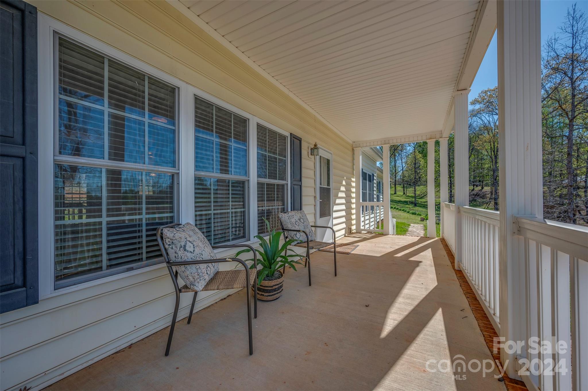1975 Whiteside Road Mill Spring, NC 28756 - Photo 4 of 37 a balcony with furniture and a potted plant