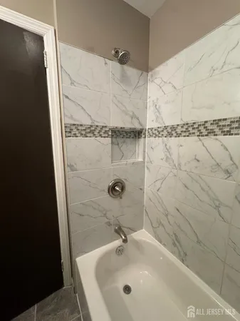 a bathroom with a sink and a shower