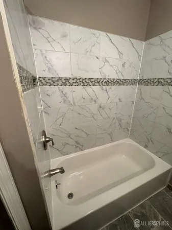 a bathroom with a bathtub