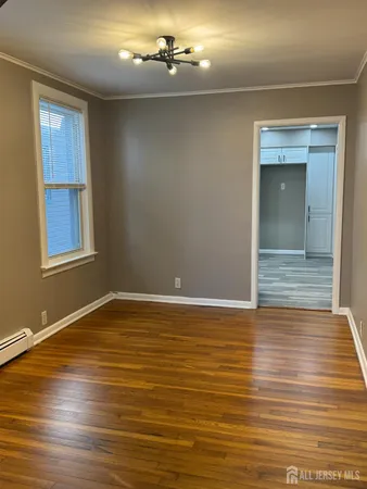 wooden floor in an empty room with window