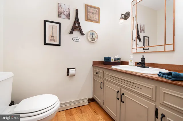 a living room with furniture rug and wooden floor