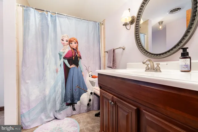 a bathroom with a toilet and a sink