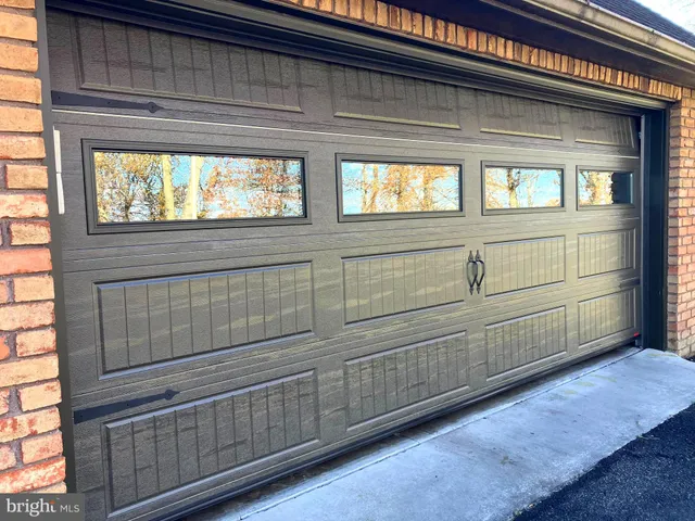 a view of a livingroom with furniture and natural light