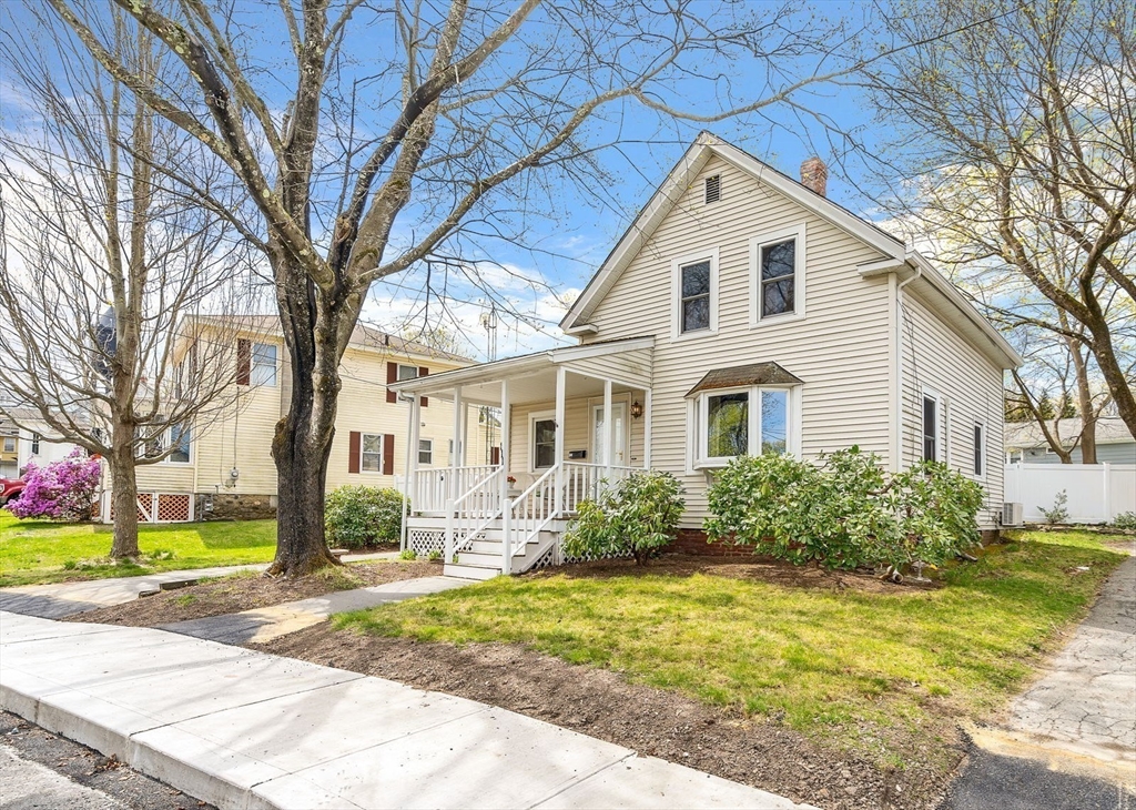111 Spring Street Marlborough, MA 01752 - Photo 1 of 42 a front view of a house with garden
