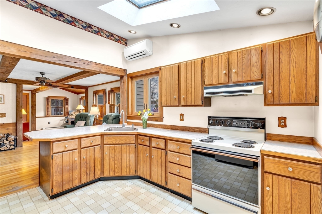 111 Spring Street Marlborough, MA 01752 - Photo 17 of 42 a kitchen with a sink stove and cabinets