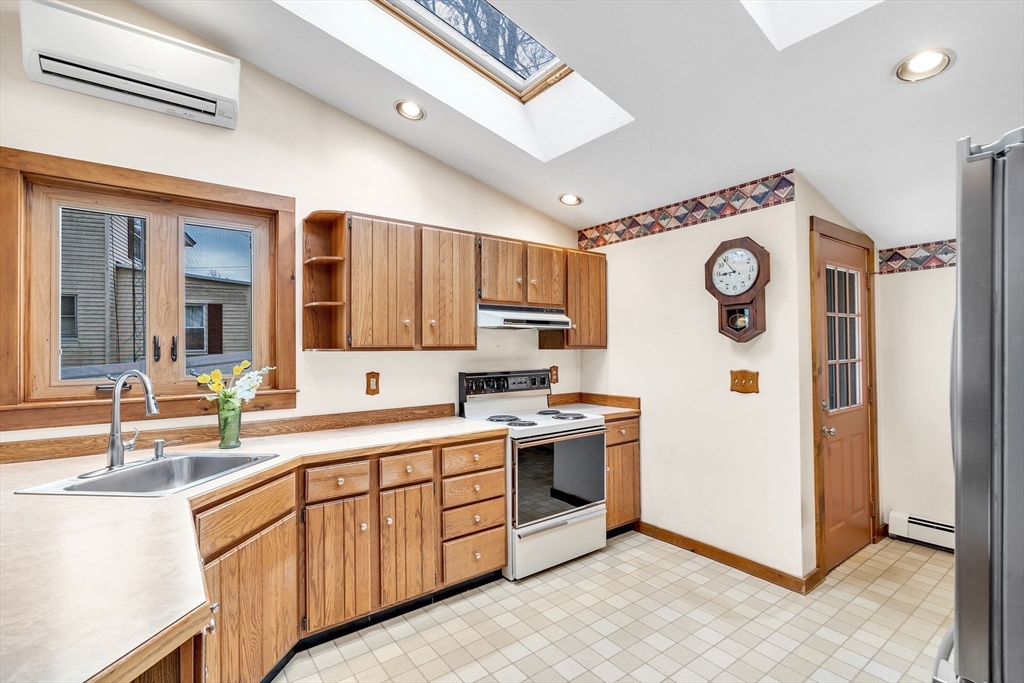 111 Spring Street Marlborough, MA 01752 - Photo 19 of 42 a kitchen with stainless steel appliances granite countertop a refrigerator and a sink