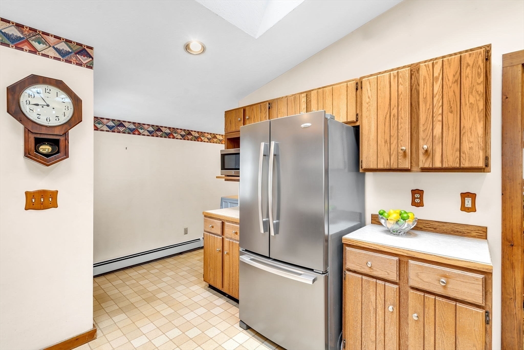 111 Spring Street Marlborough, MA 01752 - Photo 20 of 42 a kitchen with refrigerator and cabinets