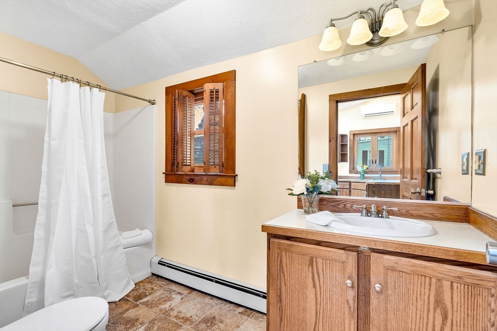 111 Spring Street Marlborough, MA 01752 - Photo 22 of 42 a bathroom with a sink vanity mirror and toilet