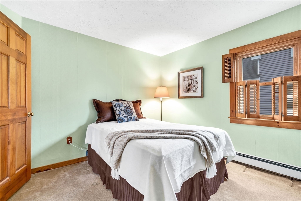 111 Spring Street Marlborough, MA 01752 - Photo 25 of 42 a bedroom with a bed and a window