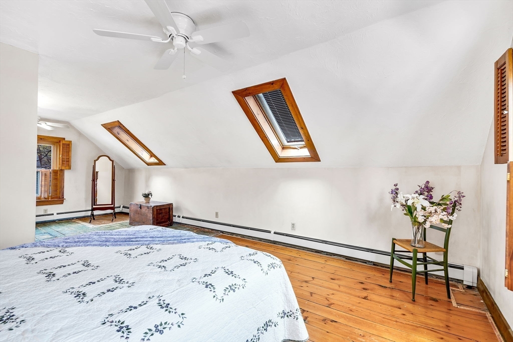 111 Spring Street Marlborough, MA 01752 - Photo 28 of 42 a bedroom with a bed and a dresser