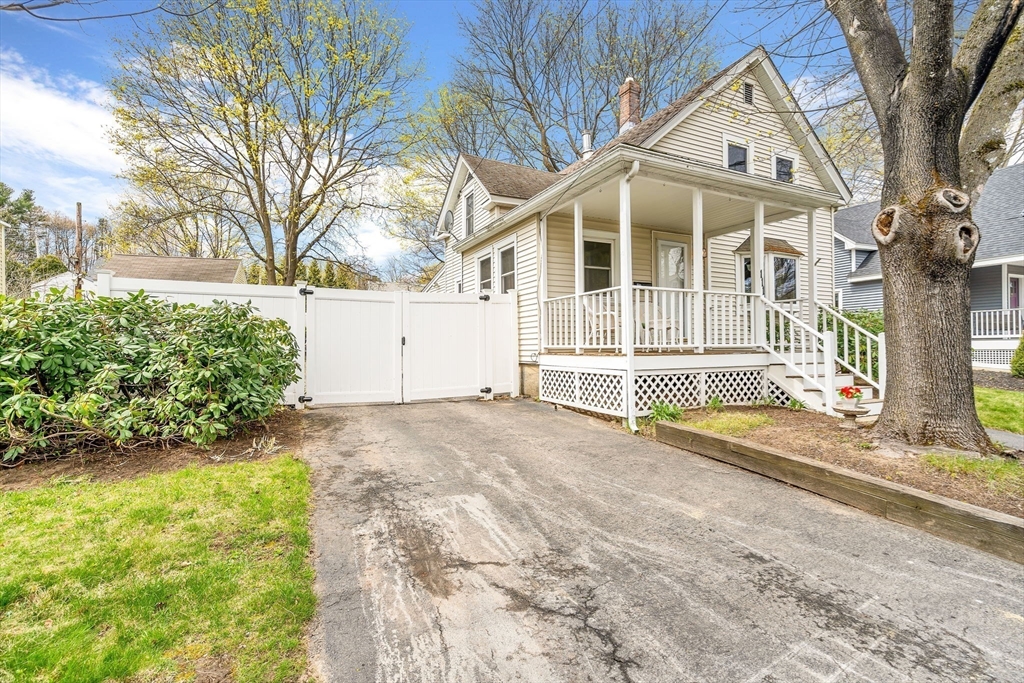 111 Spring Street Marlborough, MA 01752 - Photo 3 of 42 a view of a house with a yard and large tree