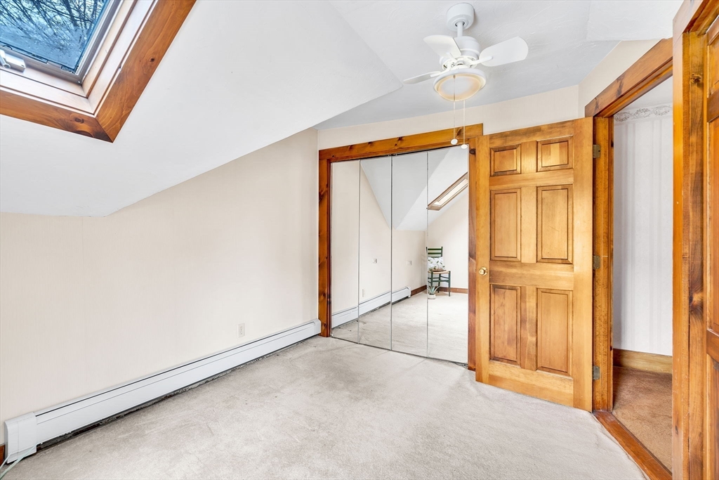 111 Spring Street Marlborough, MA 01752 - Photo 32 of 42 an empty room with a ceiling fan and windows