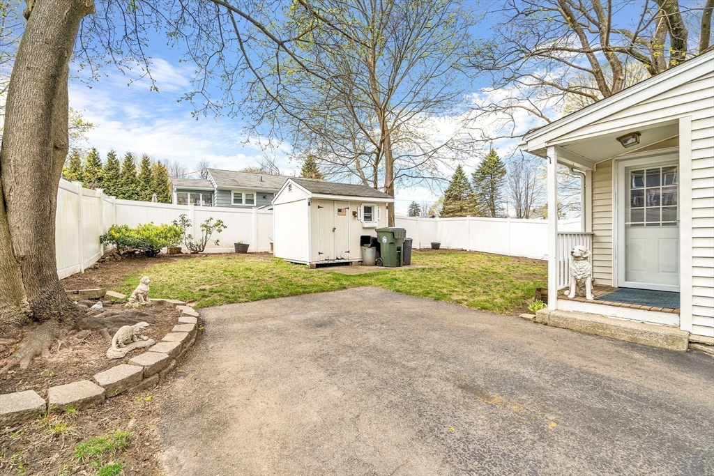 111 Spring Street Marlborough, MA 01752 - Photo 4 of 42 a view of a white house with a big yard and large tree