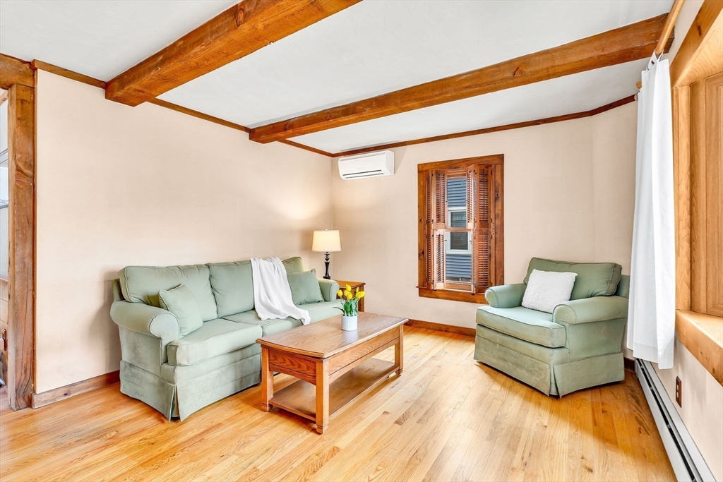 111 Spring Street Marlborough, MA 01752 - Photo 8 of 42 a living room with furniture and a large window