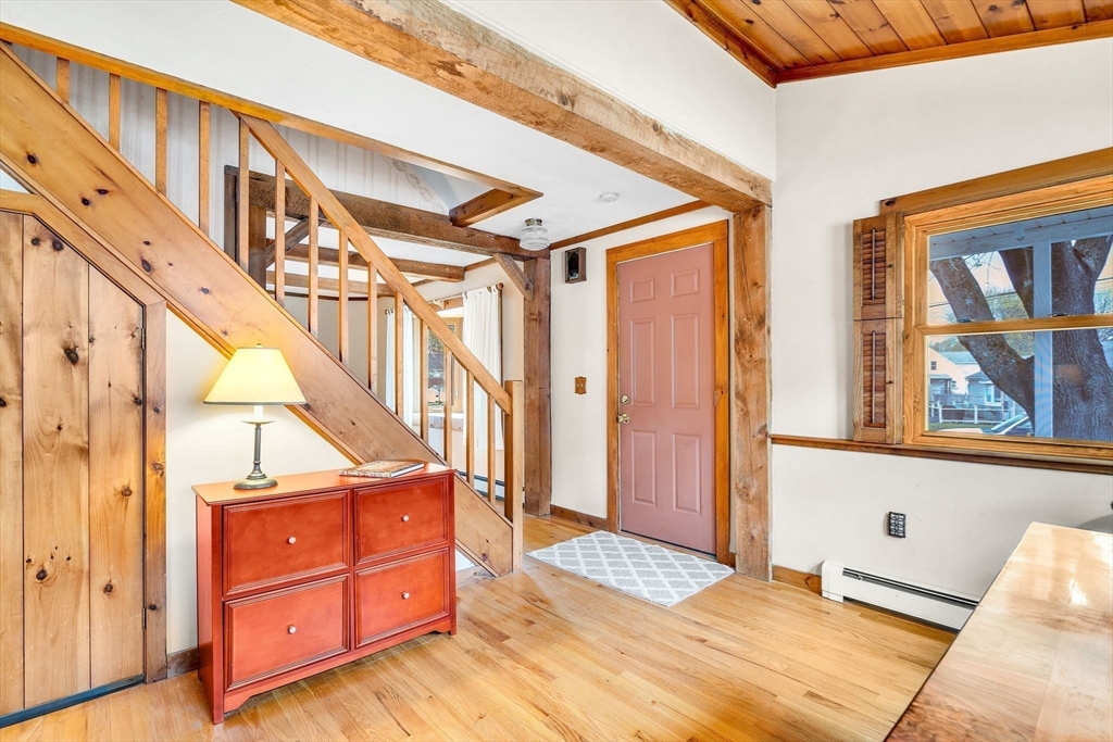 111 Spring Street Marlborough, MA 01752 - Photo 9 of 42 a view of a bedroom with wooden floor and windows