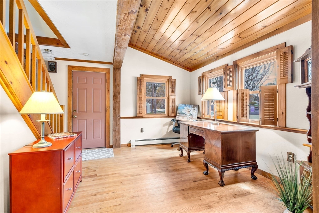 111 Spring Street Marlborough, MA 01752 - Photo 10 of 42 a living room with furniture stove and a window