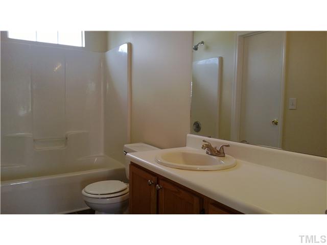 2900 Oneida Court Raleigh, NC 27610 - Photo 7 of 7 a bathroom with a sink a toilet and shower