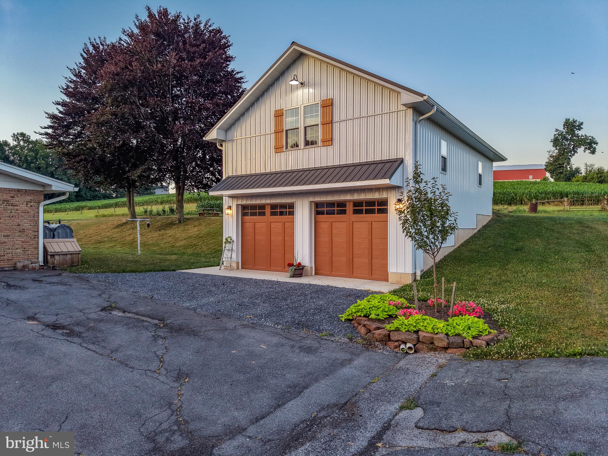 475 South Cocalico Road Denver, PA 17517 - Photo 8 of 91 a front view of a house with a yard and a garage