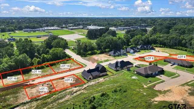 an aerial view of an outdoor space swimming pool patio and mountain view
