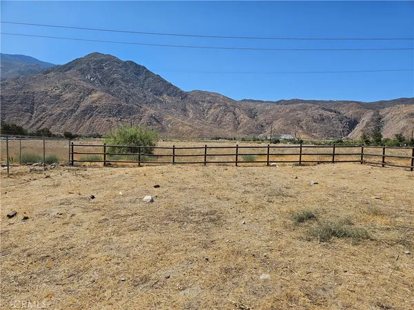 a view of house with mountain view