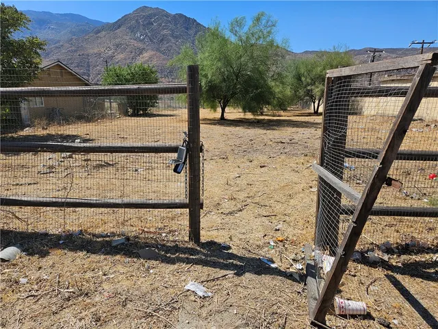a view of a balcony with wooden floor and a mountain view