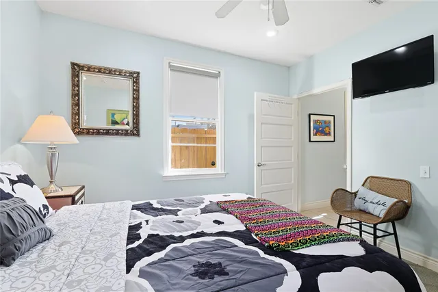 a bedroom with a bed and a lamp