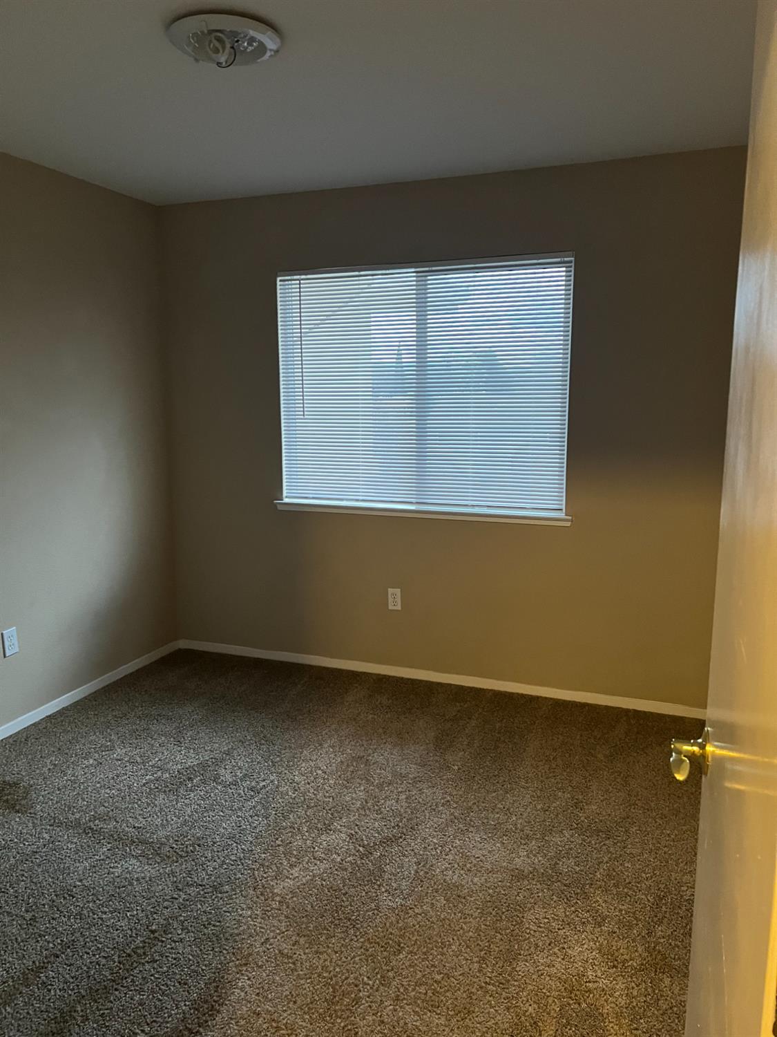 565 Peerless Way, Unit 302 Tracy, CA 95376 - Photo 14 of 17 an empty room with a window