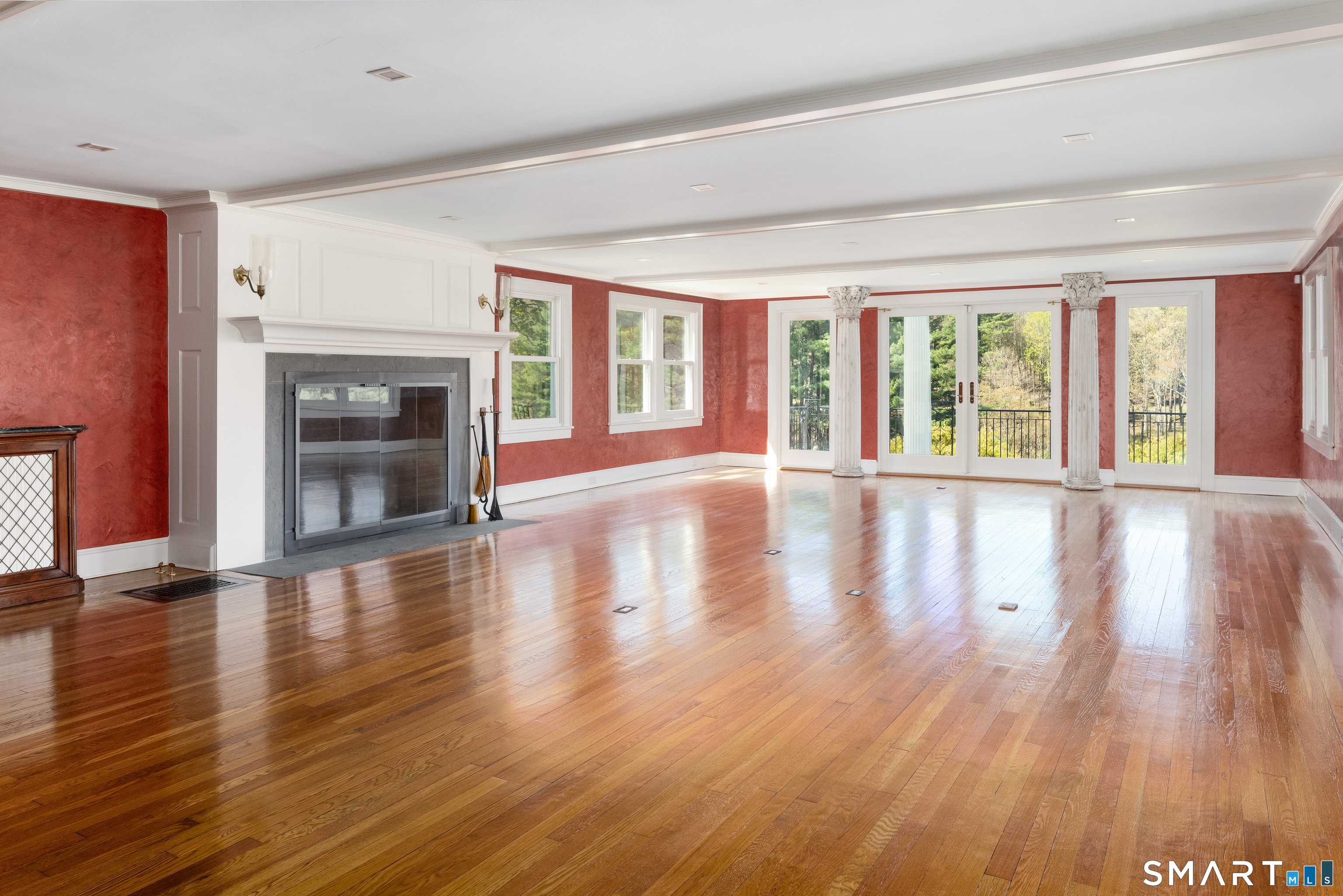 155 Long Ridge Road Danbury, CT 06810 - Photo 23 of 40 Unfurnished, the room reveals its scale, symmetry, and remarkable run of windows across the gardens.