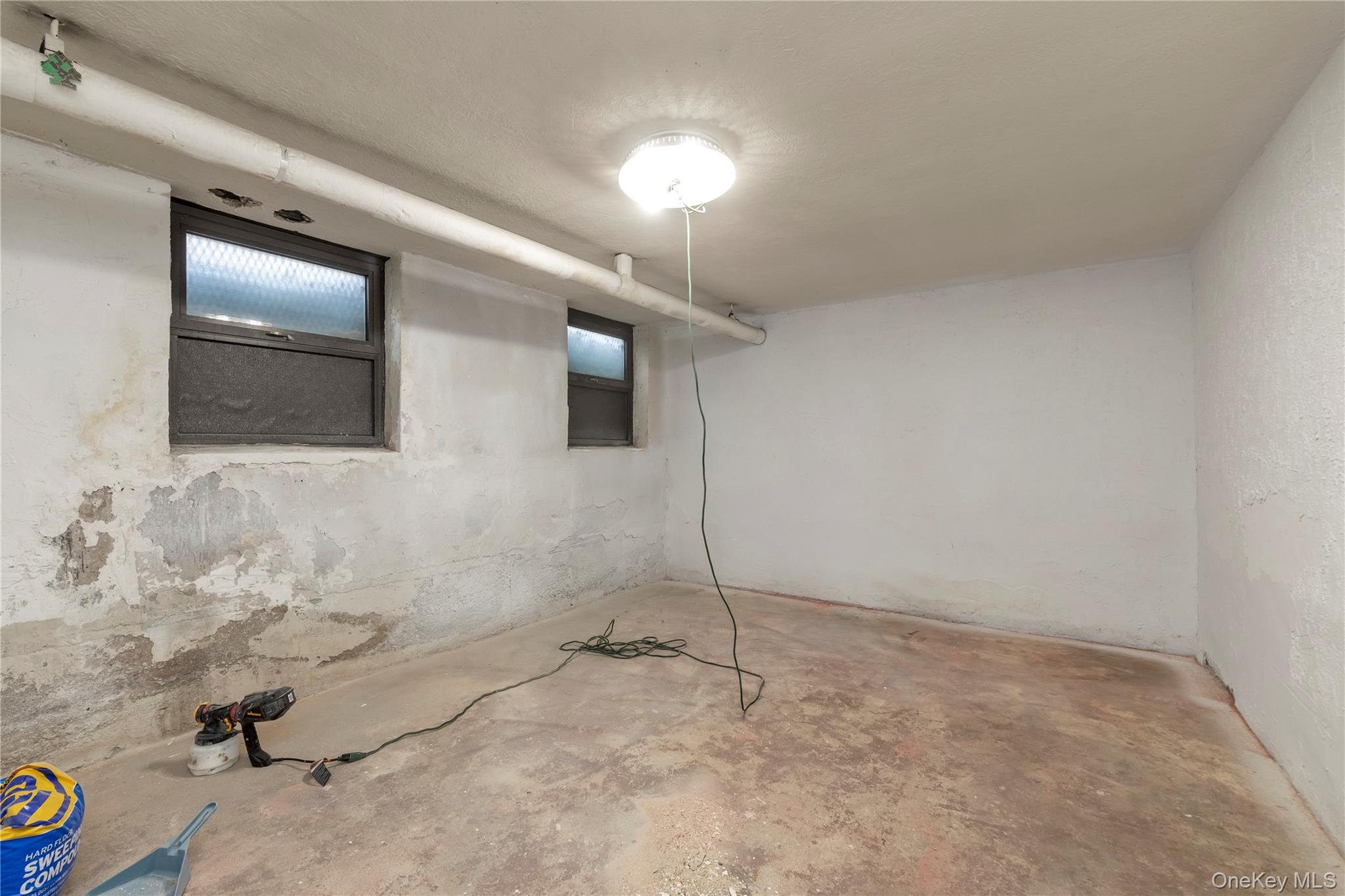 19-54 79th Street, Unit 2 Queens, NY 11370 - Photo 14 of 16 a bathroom with a sink and a mirror