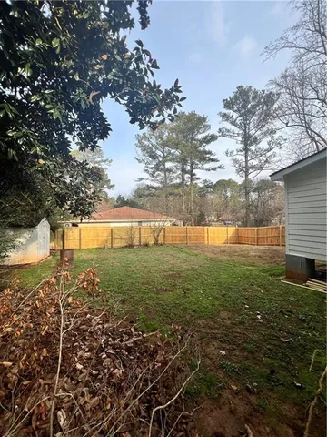 a view of a yard with a tree