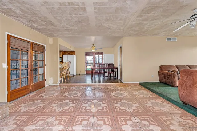 a view of a livingroom with furniture and workspace