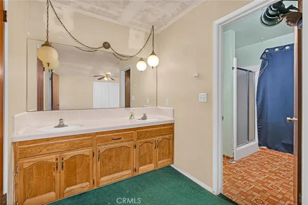 a bathroom with a sink a vanity and a mirror