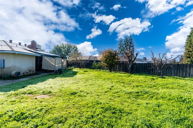 a backyard of a house with lots of green space