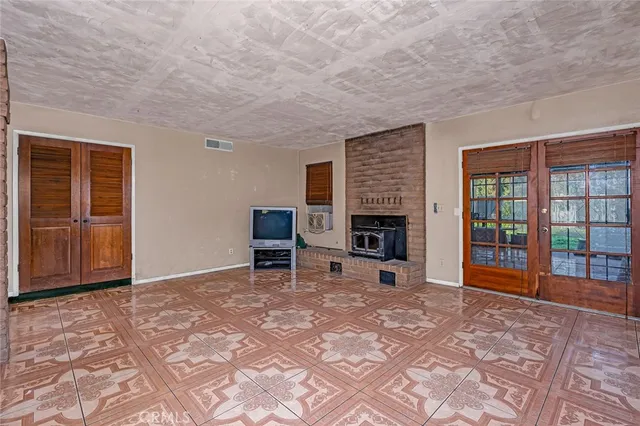 a view of a livingroom with furniture and a fireplace