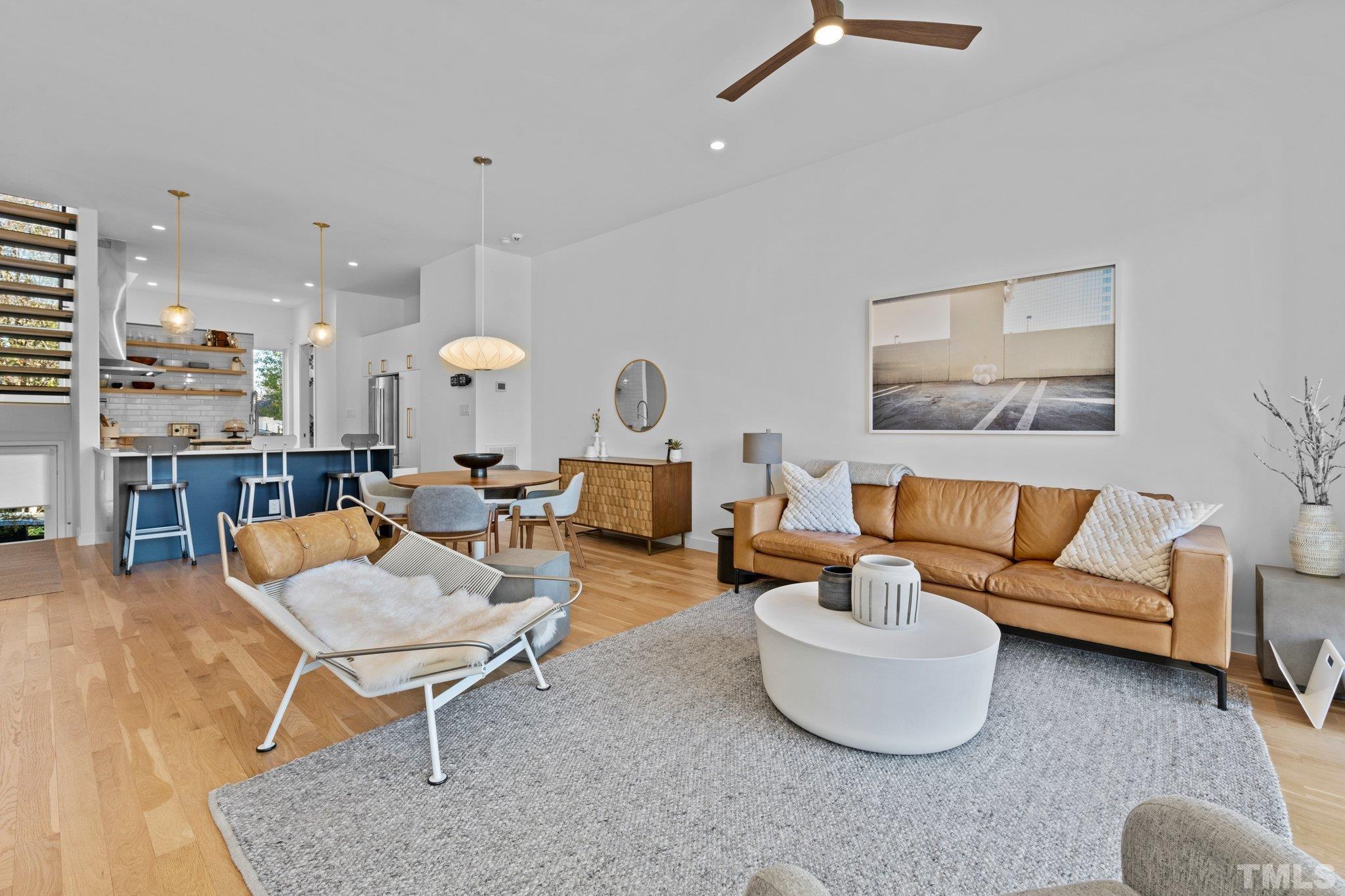 426 Chavis Way Raleigh, NC 27601 - Photo 13 of 35 a living room with furniture and a large window