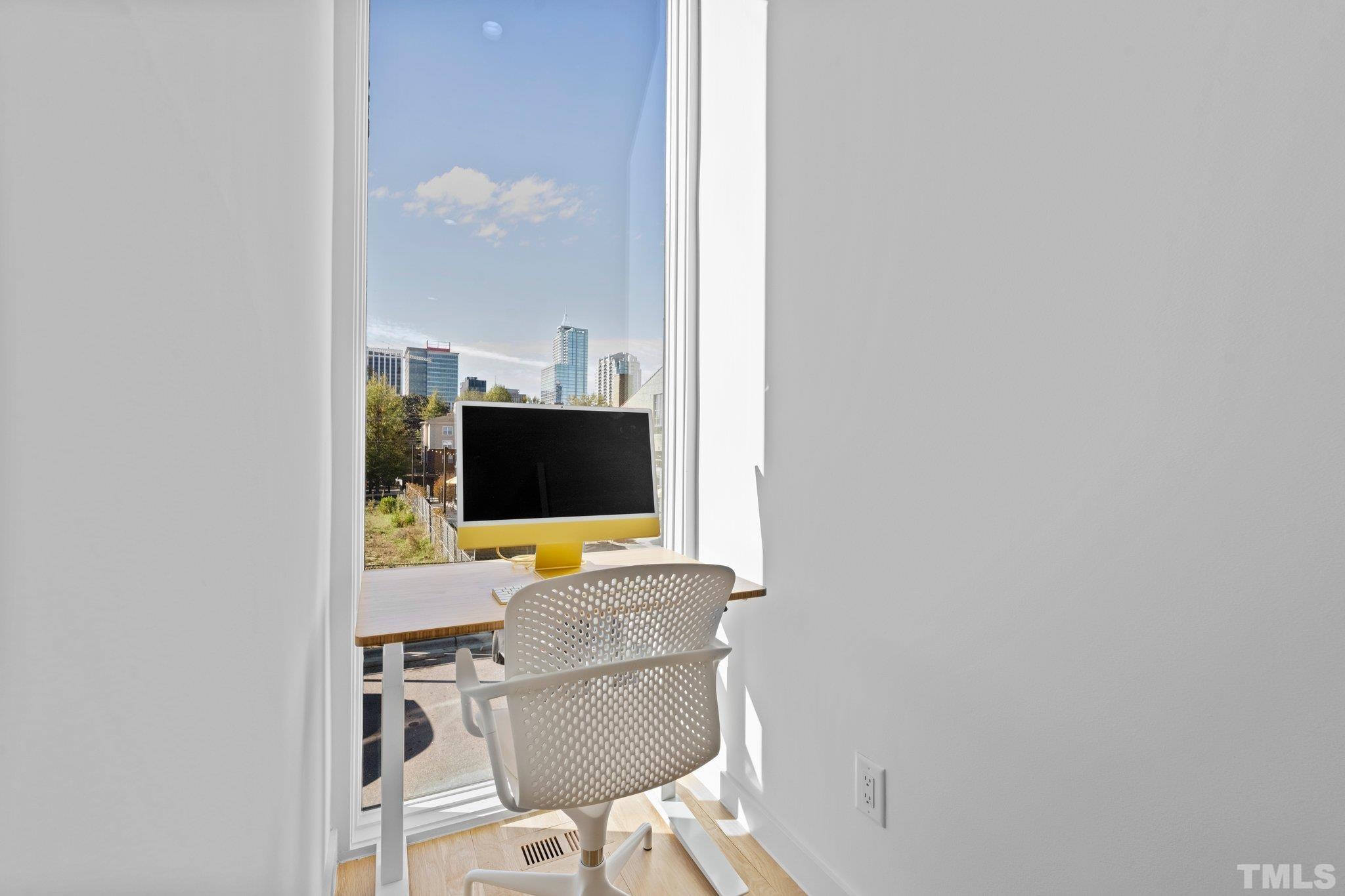 426 Chavis Way Raleigh, NC 27601 - Photo 15 of 35 a workspace with furniture and mirror