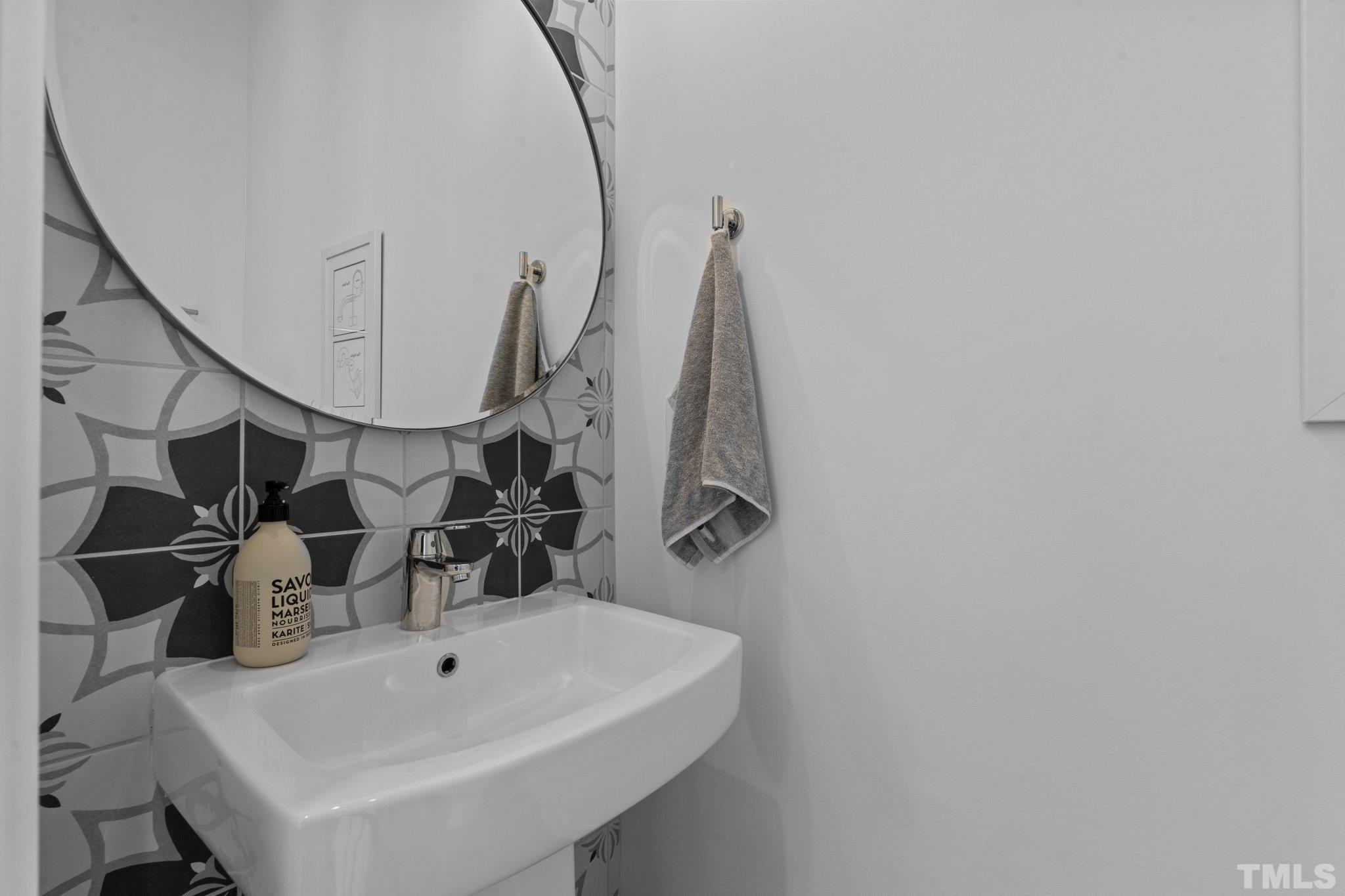 426 Chavis Way Raleigh, NC 27601 - Photo 16 of 35 a bathroom with a sink and a mirror