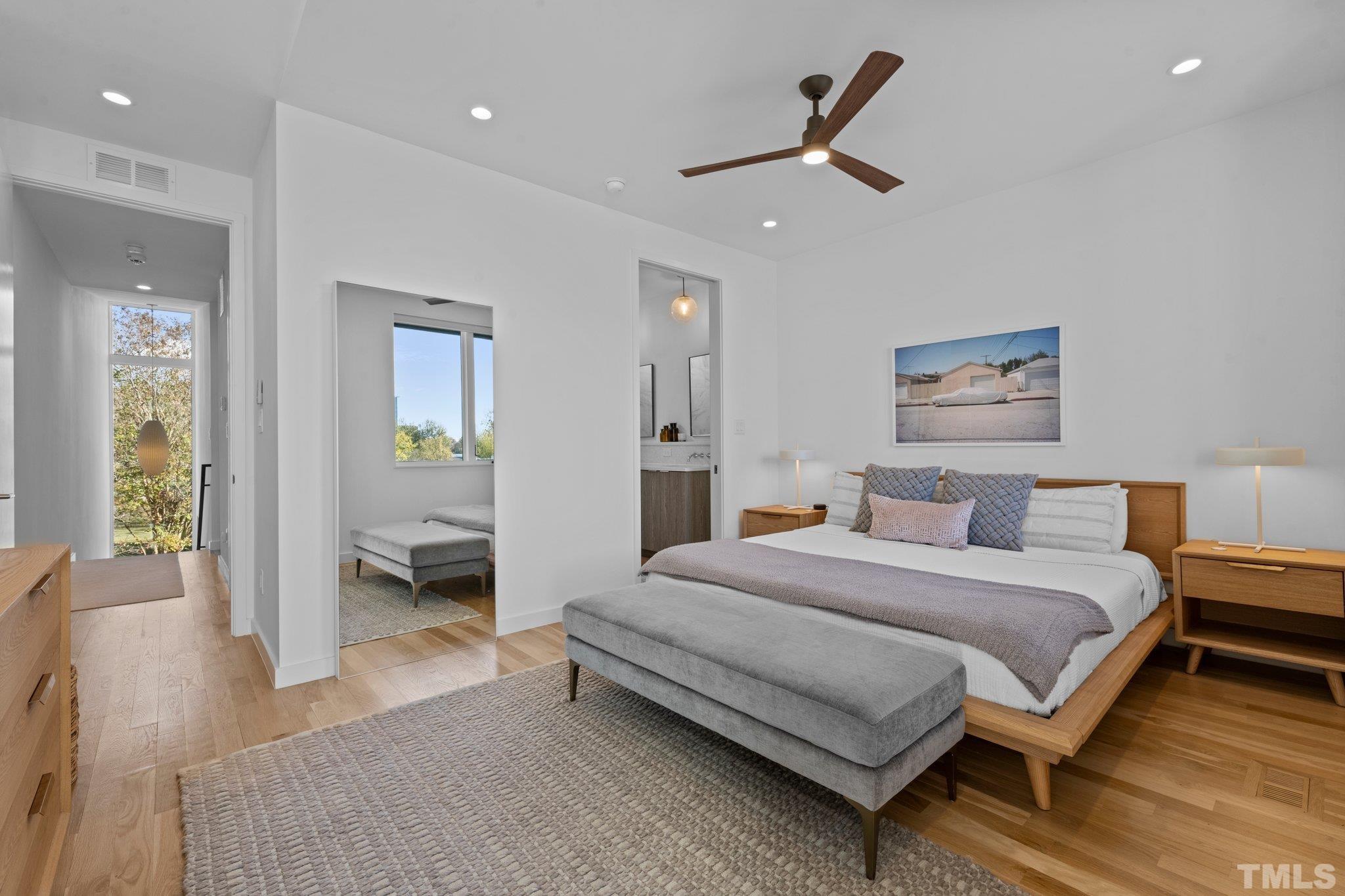 426 Chavis Way Raleigh, NC 27601 - Photo 19 of 35 a bedroom with a bed and a view of bathroom