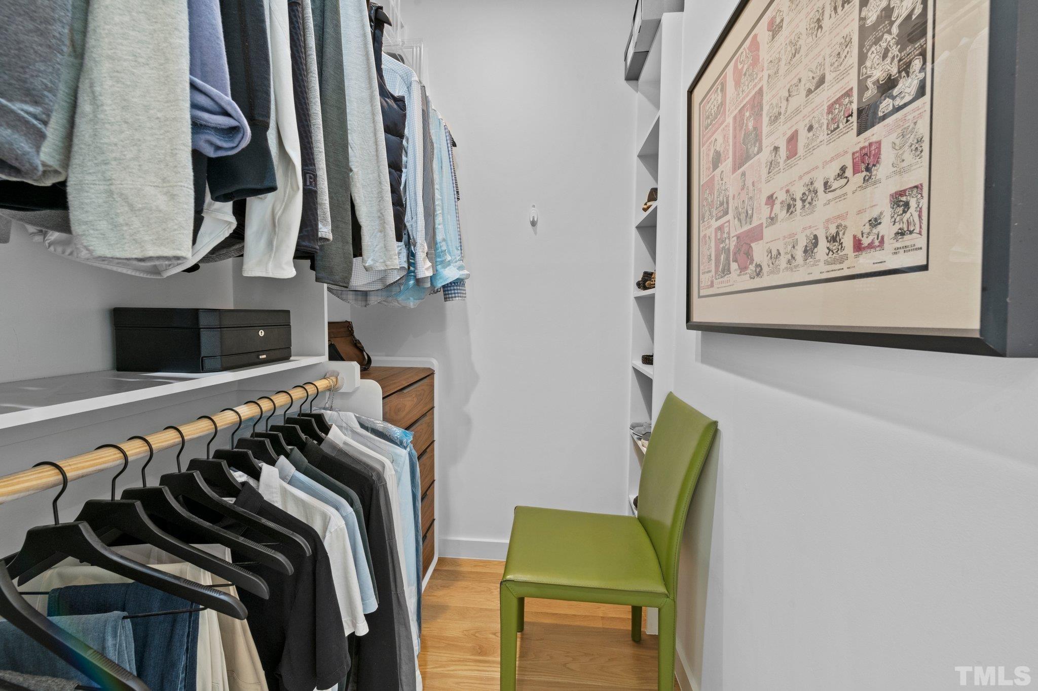 426 Chavis Way Raleigh, NC 27601 - Photo 21 of 35 a view of walk in closet with clothes