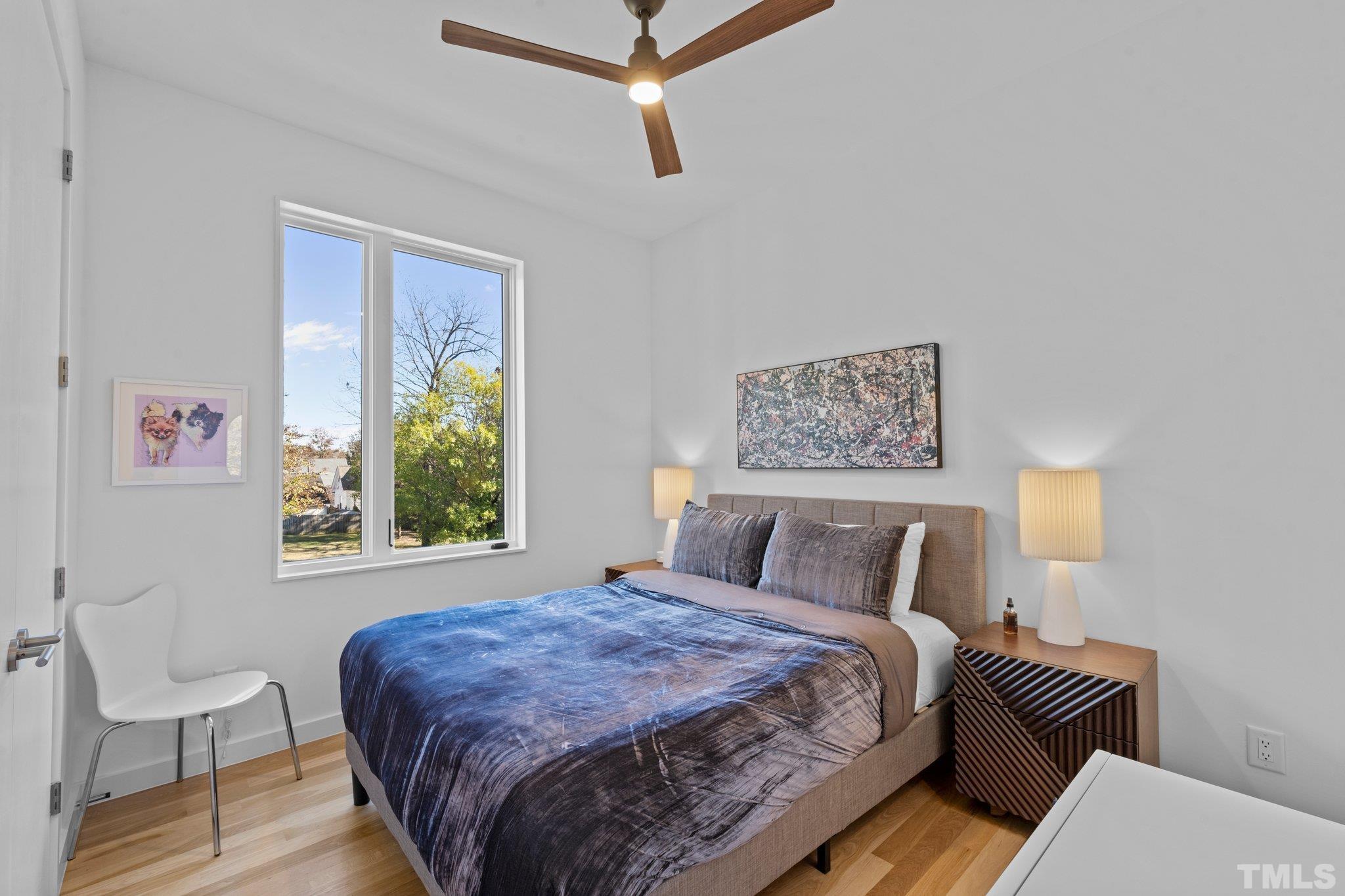 426 Chavis Way Raleigh, NC 27601 - Photo 25 of 35 a bedroom with a bed and window