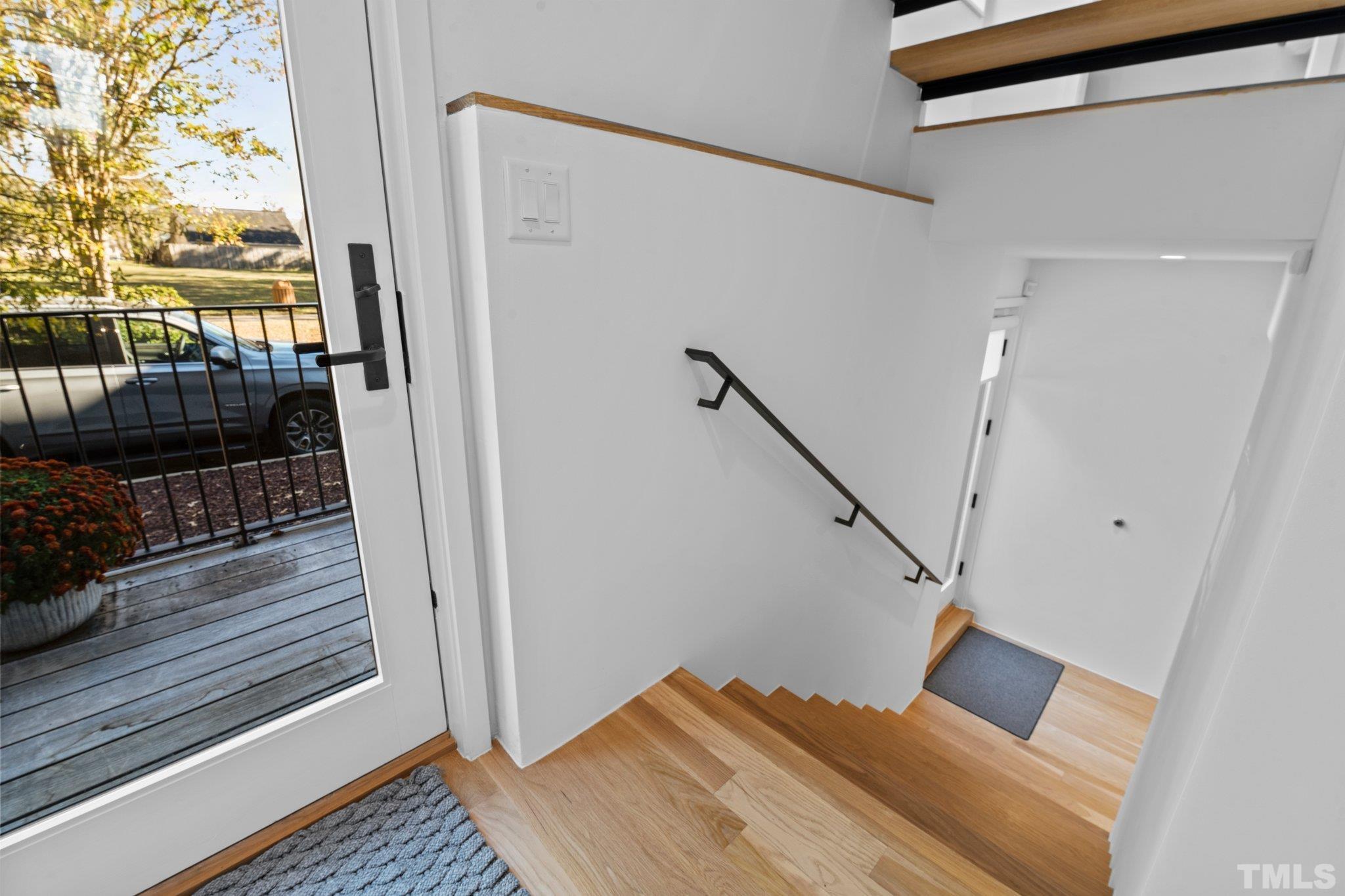 426 Chavis Way Raleigh, NC 27601 - Photo 27 of 35 a view of entryway and hall with wooden floor