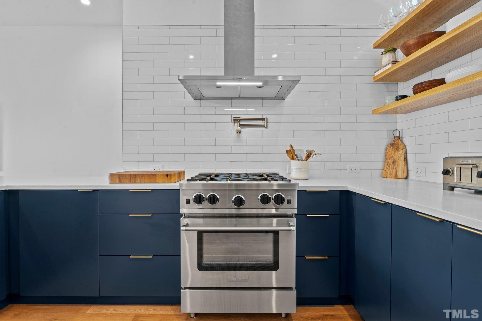 426 Chavis Way Raleigh, NC 27601 - Photo 10 of 35 a stove top oven sitting inside of a kitchen