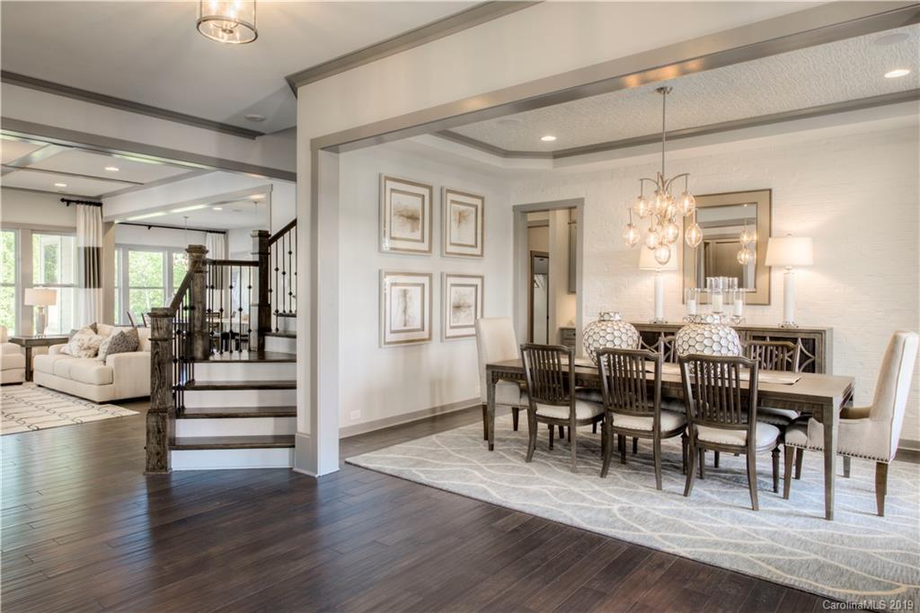 4022 Oarman Court, Unit 437 Fort Mill, SC 29708 - Photo 2 of 13 a view of a dining room with furniture window and wooden floor