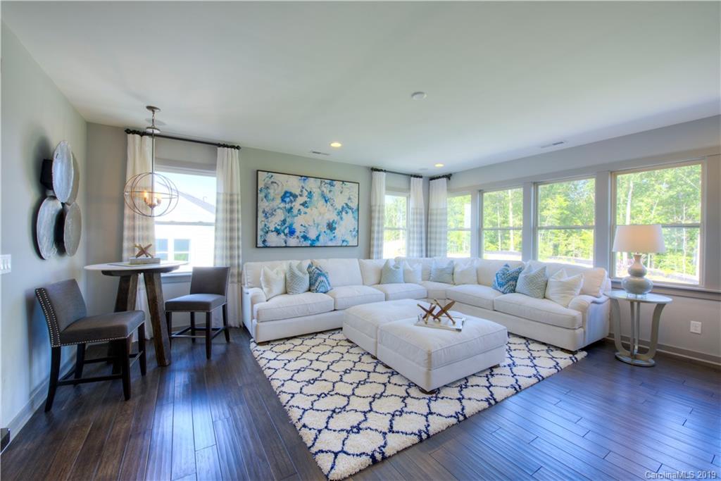4022 Oarman Court, Unit 437 Fort Mill, SC 29708 - Photo 8 of 13 a living room with furniture and a large window